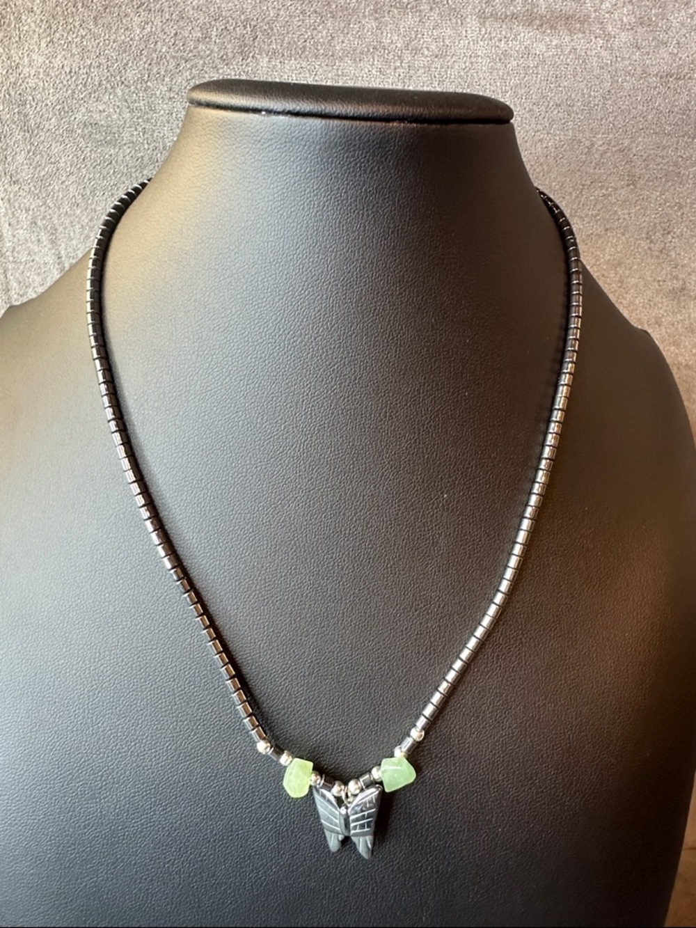 Hematite Beaded Necklace with Green Stone Accents and Butterfly Pendant
